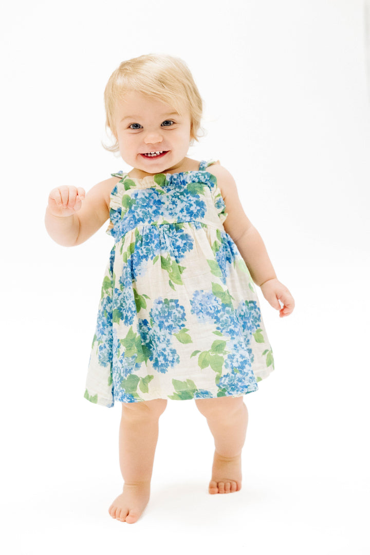 little girl modeling hydrengea dress, showing it hits at the knee. 