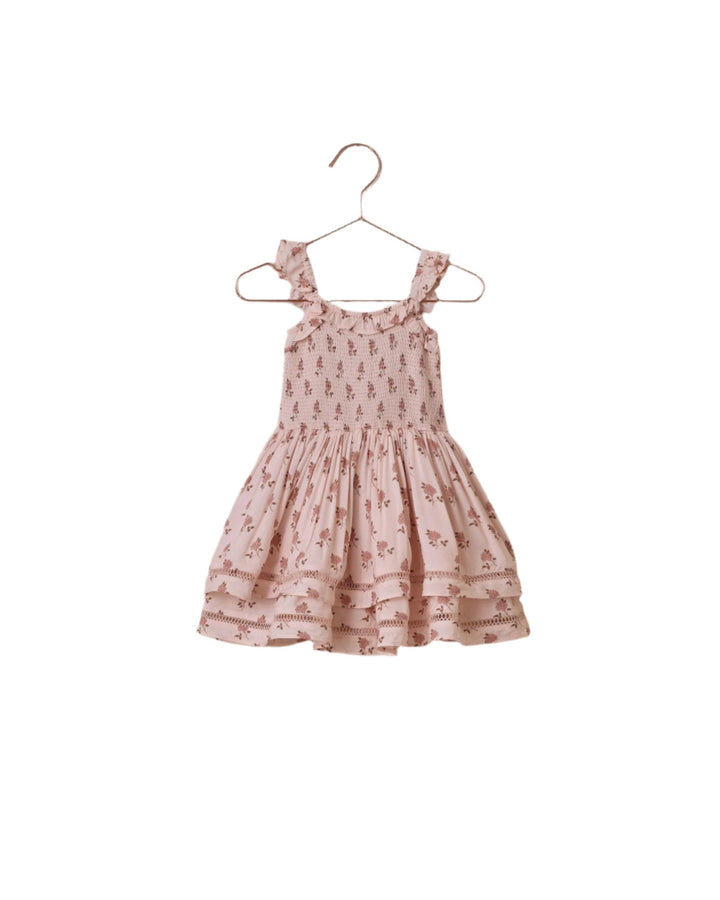 smocked top of a sleeveless dress, dusty pink ground with rosebud print all over the bodice and skirt. 