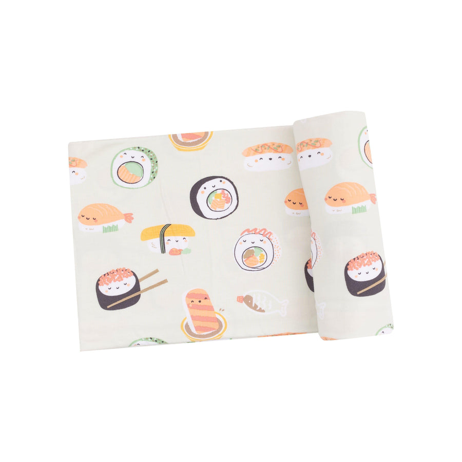 bamboo swaddle with sushi print on the swaddle in a pistachio green color. 