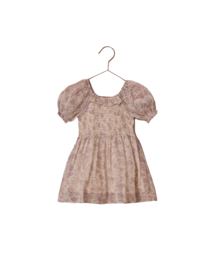short sleeve dress with smocked top and chiffon bodice and skirt. beige ground with lavender floral print on the chiffon. 