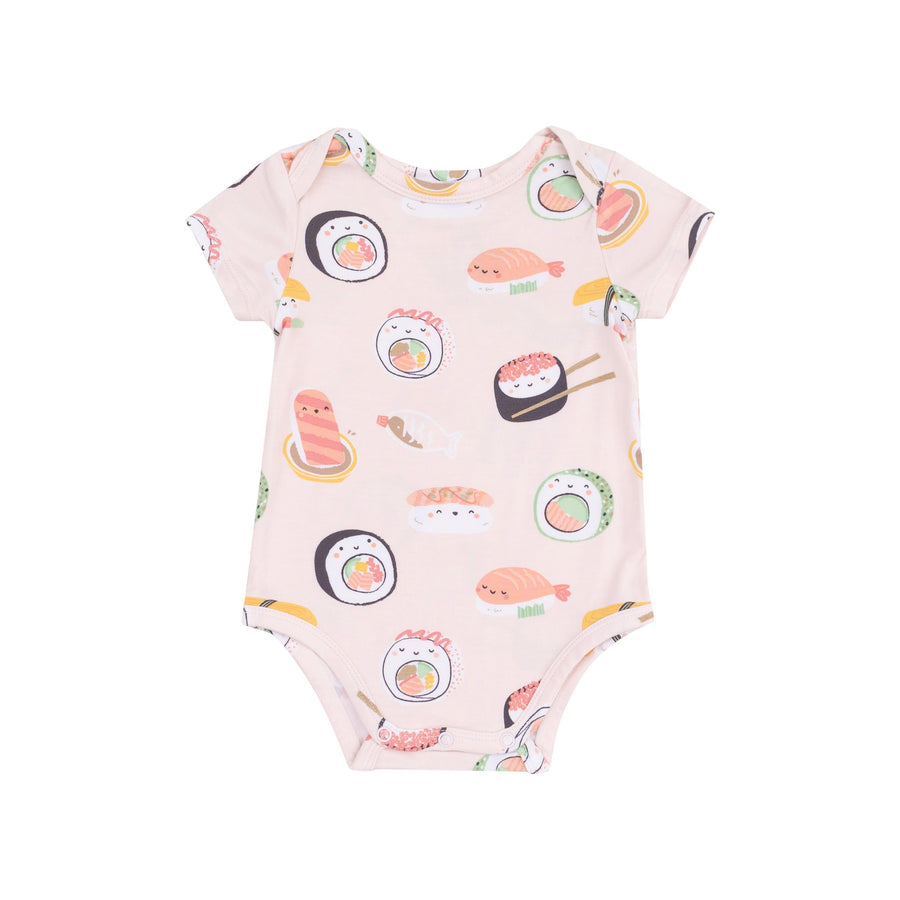 baby pink bodysuit with sushi printed on it with little faces on each piece of sushi. 