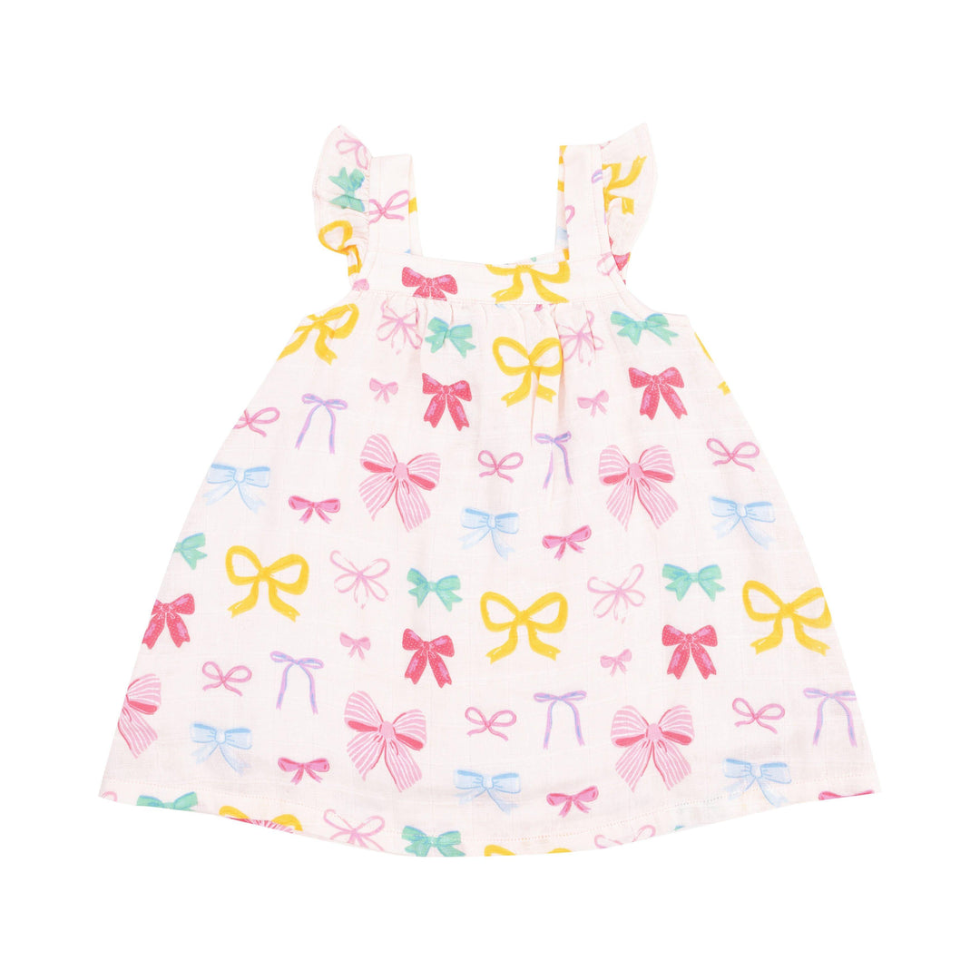 white girls dress with multi colored coquette bows all over: pink, yellow, green and purple. 
