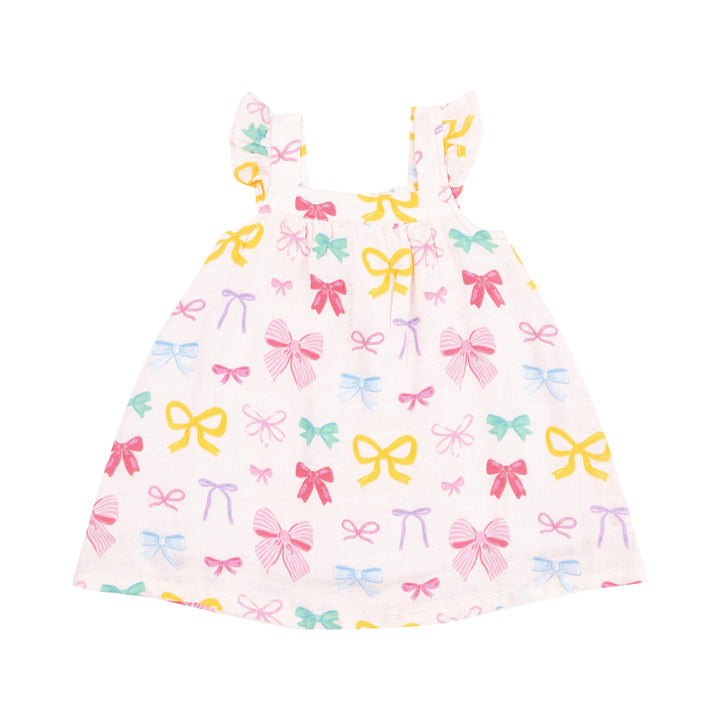 white girls dress with multi colored coquette bows all over: pink, yellow, green and purple. 