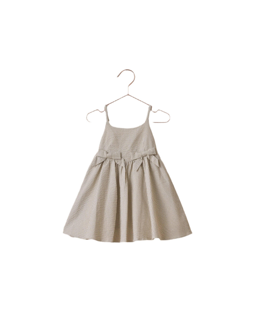 sage stripe dress with spaghetti straps that cross in the back with two bows in the front at the skirt. 