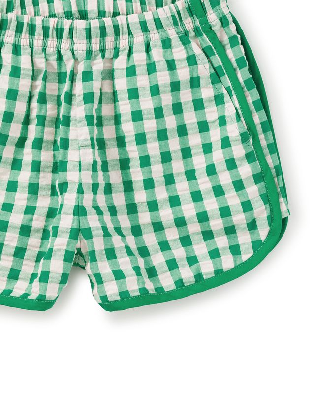 Green and white checkered shorts on a white background