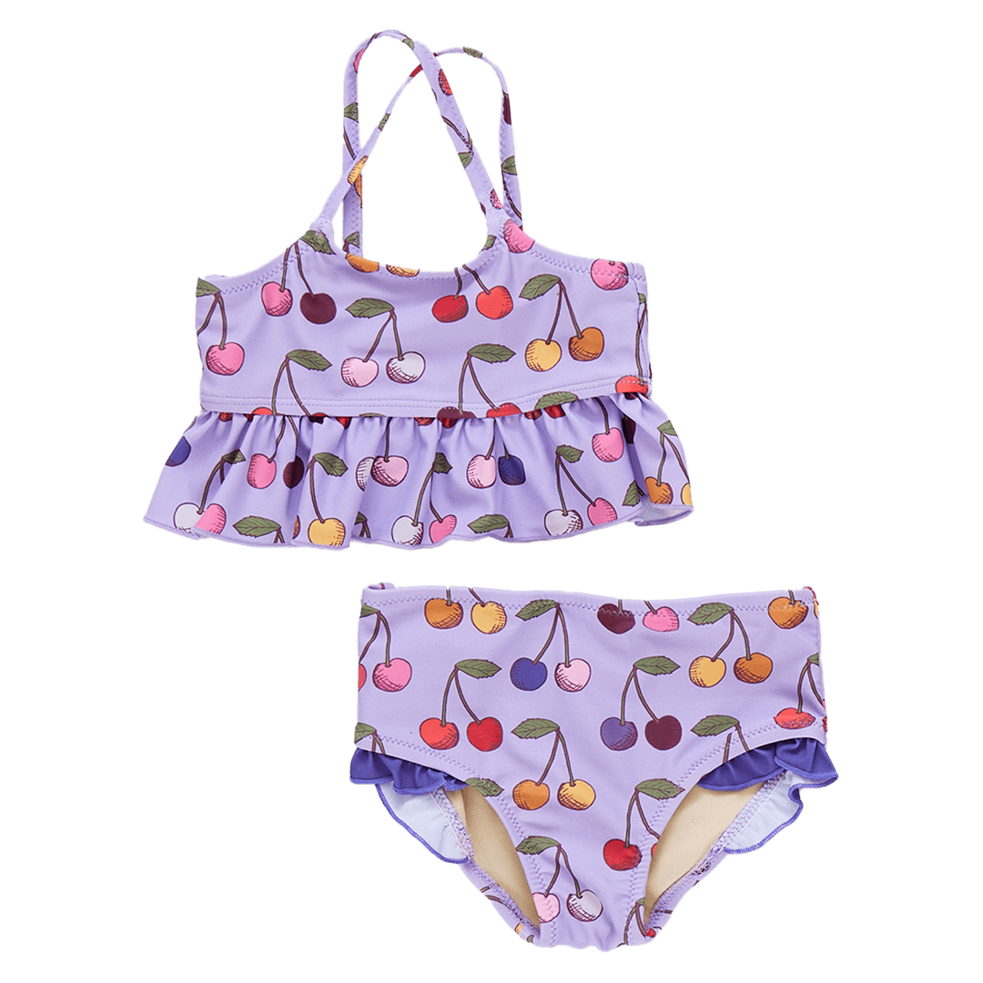 two piece bathing suit with all over cherry design. The cherries are multi colored. the top has a large ruffle at the bottom for added coverage and the bottom is a full cut with tiny purple ruffles at the top of the leg 