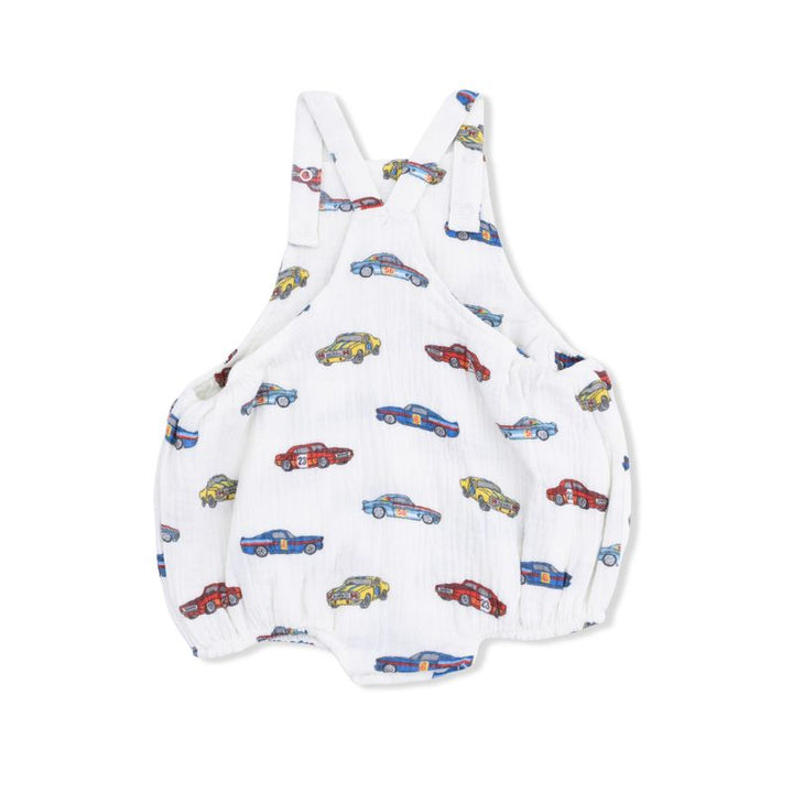 back of White baby romper with colorful car pattern on a white background