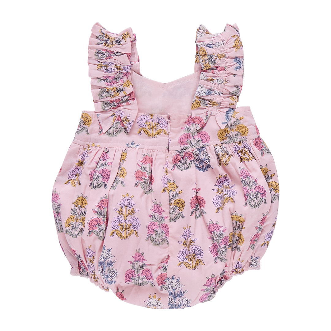 back of baby bubble pink in color with bohemian flowers all over the bubble. ruffled sleeves from front to back and zipper closure. 