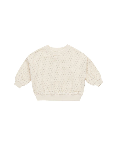 beige velour sweatshirt with gray polka dots on it. 