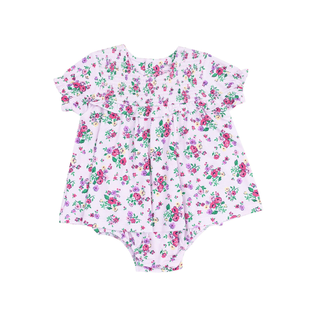 short sleece dress with an attached bodysuit, lavender color with dep pink and purple flowers all over the outfit. 