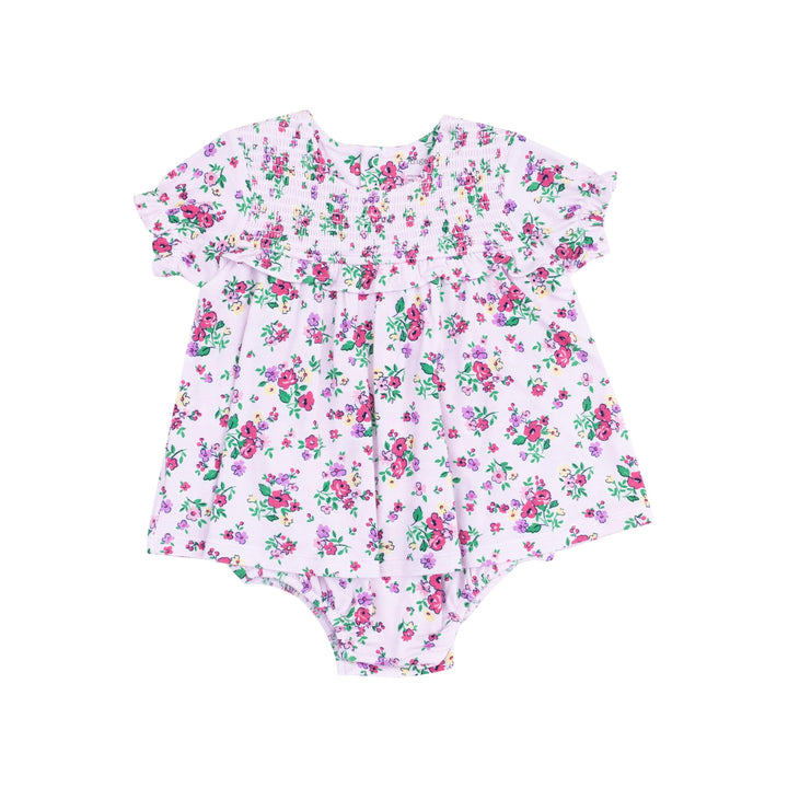 short sleece dress with an attached bodysuit, lavender color with dep pink and purple flowers all over the outfit. 