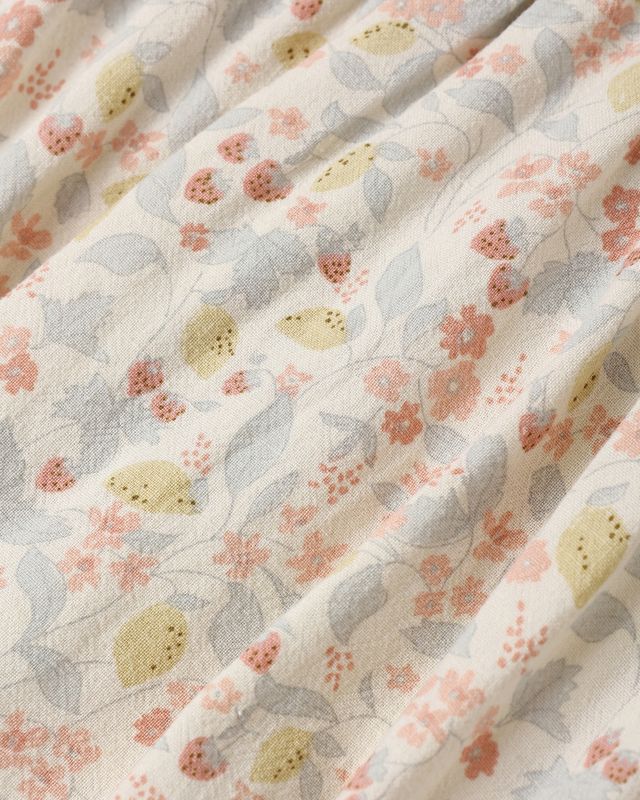 Floral fabric with pink, yellow, and gray flowers on a white background