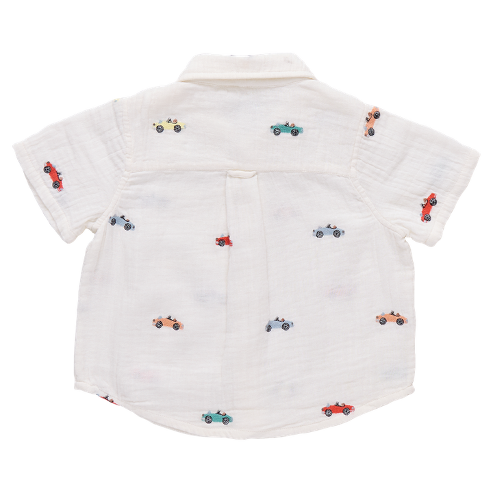 White shirt with small car patterns on a white background