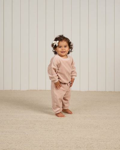 baby girl modeling blush velour sweatset