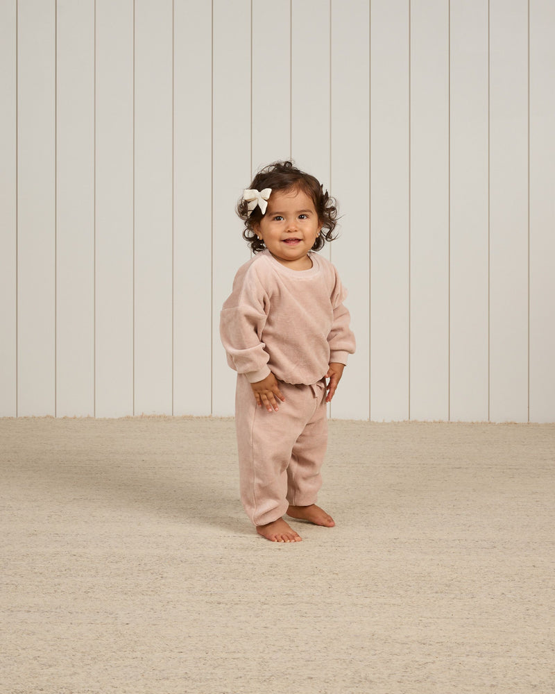 baby girl modeling blush velour sweatset