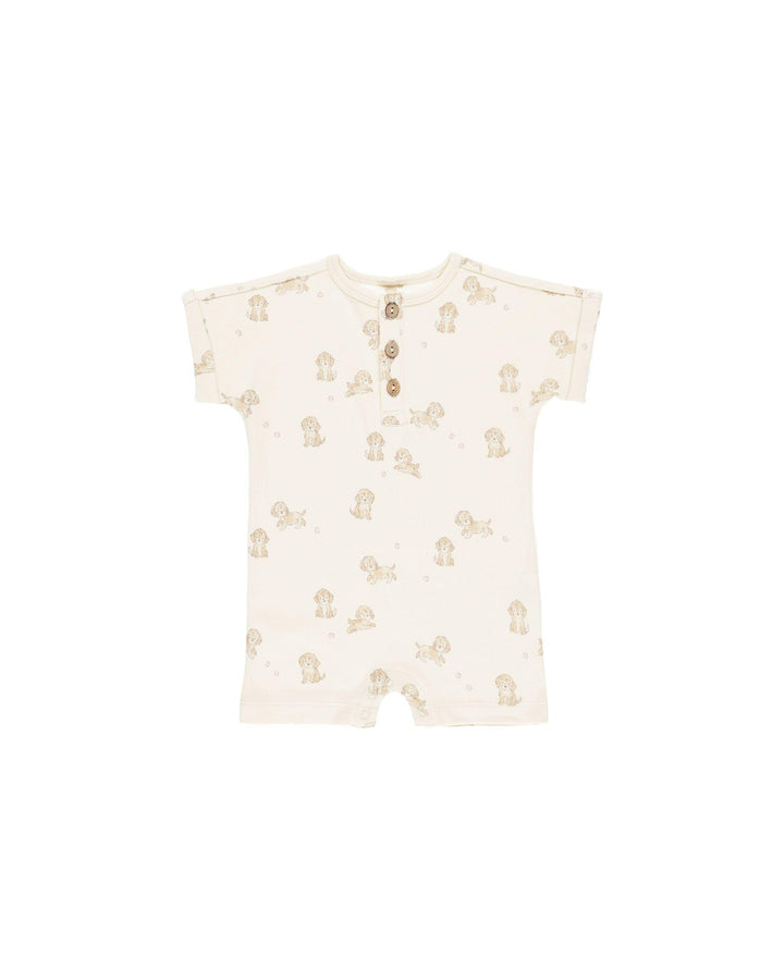 short sleeve puppy print romper with three buttons going down the front of the onesie. 