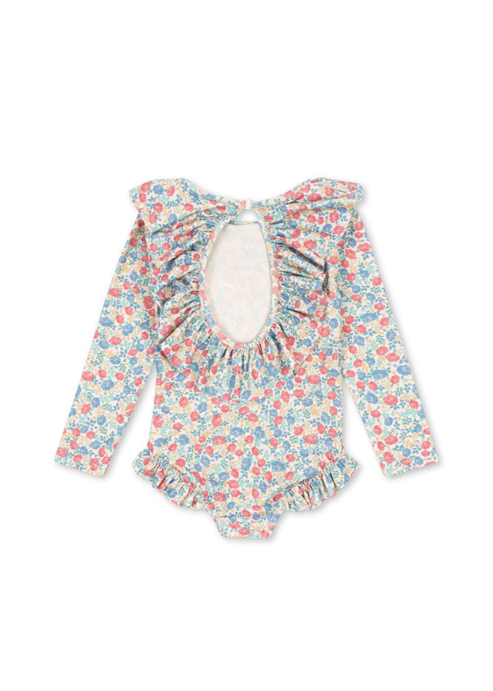 long sleeve rashguard with cutout in the back with large ruffles around the cutout and ruffles at the leg opening. 