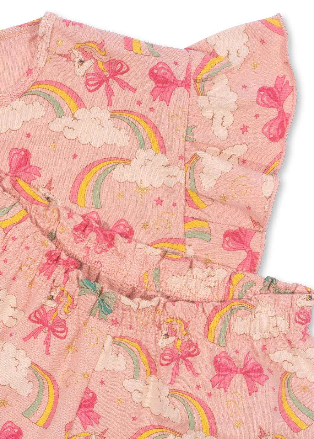 close up picture of the print and the colors in the set. light pink colorway with unicorns, rainbows and clouds all over the set. 