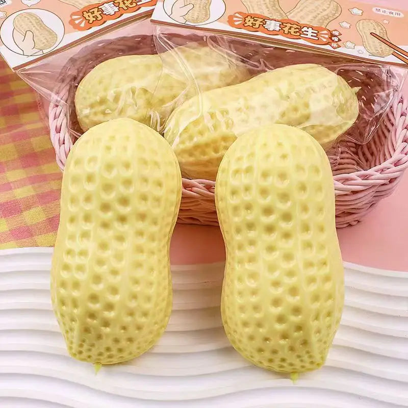 Packaged peanut squish toys with a pink checkered background