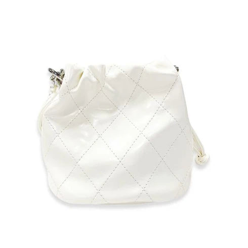 White quilted handbag on a white background
