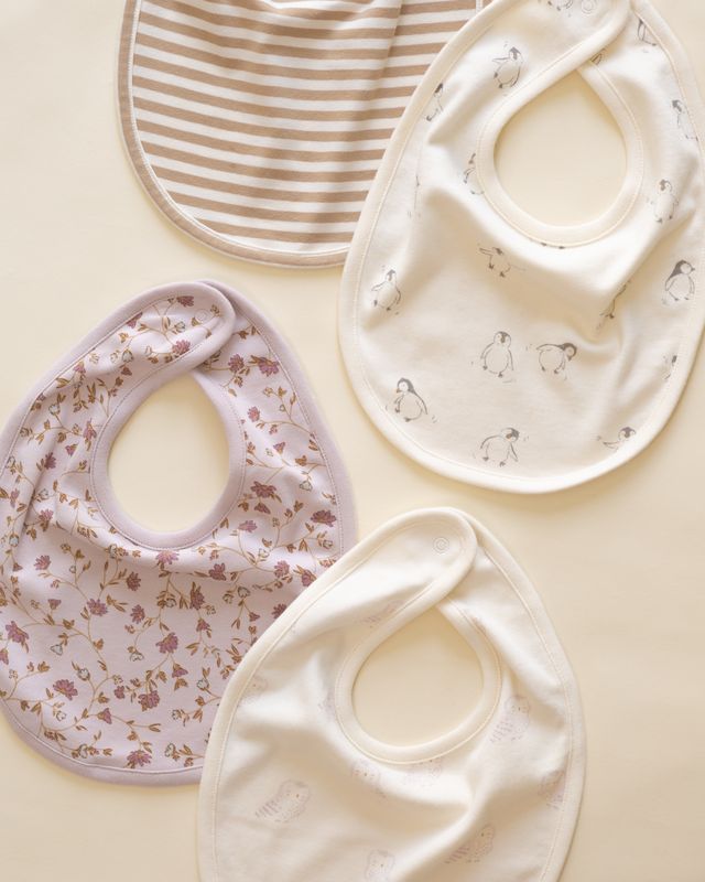 Set of baby bibs with different patterns on a light background