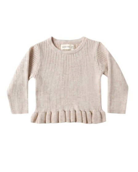 Beige ribbed sweater with ruffle hem on a white background
