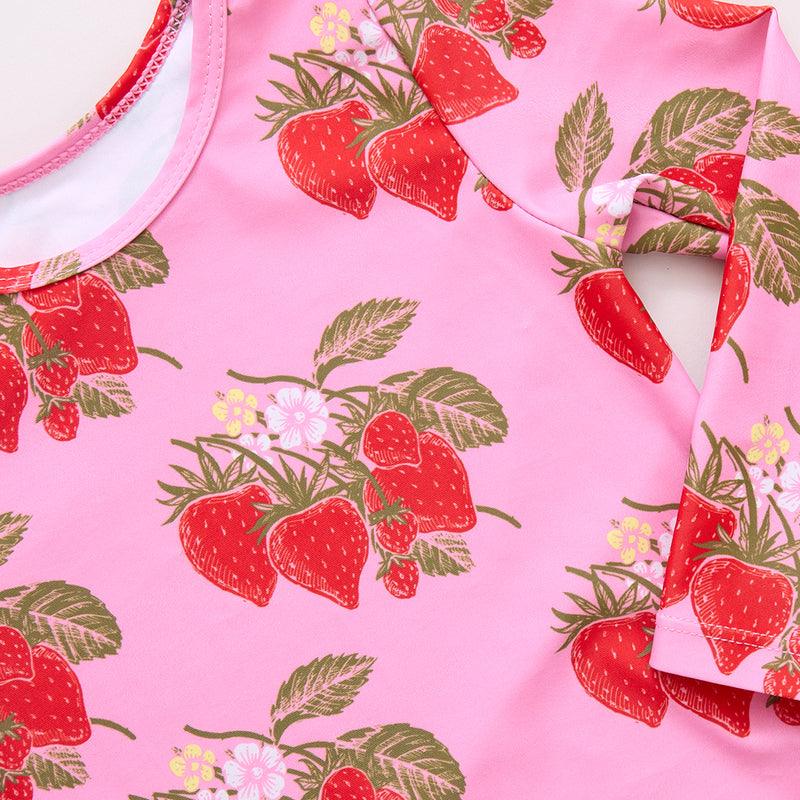 close up to the strawberry print on the rashguard. 