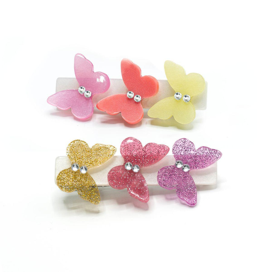 set of 2 alligator clips each with 3 butterflies on them: pink, orange, yellow. one clip is pearlized and one is glitter. 