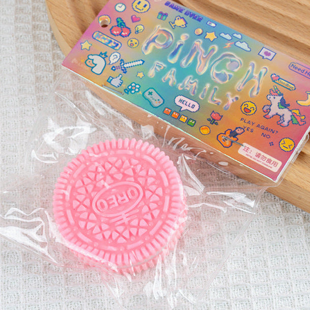 Pink oreo cookie squish toy with packaging labeled 'Punch Family' on a light background