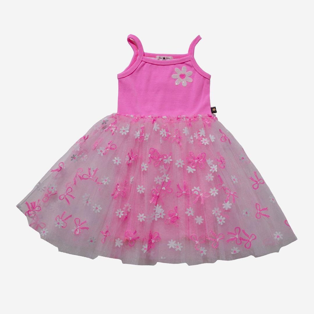 hot pink spaghetti strap dress with cotton underlay and slip with white tulle skirt with daisies and pink bows all over the skirt. 