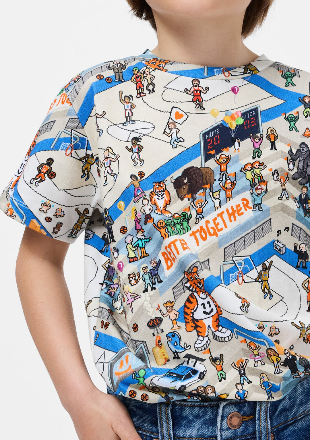 Child wearing a colorful t-shirt with a sports-themed graphic design.