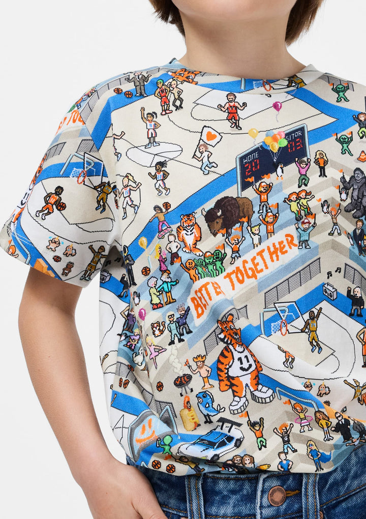 Child wearing a colorful t-shirt with a sports-themed graphic design.