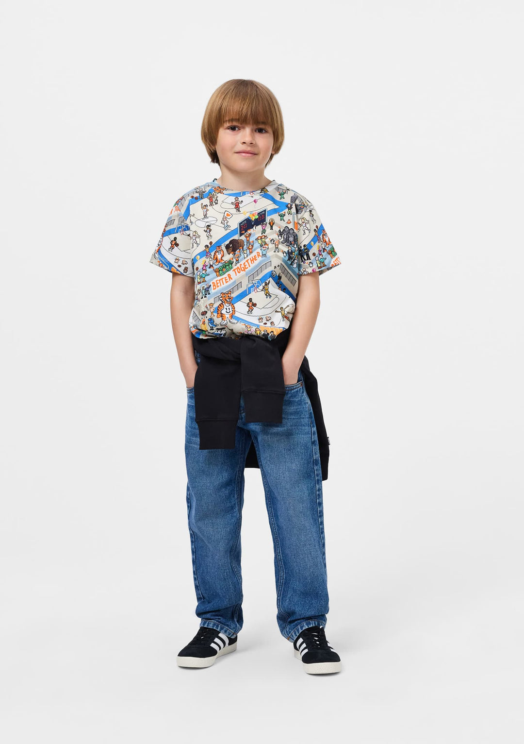 Child wearing a patterned shirt and jeans on a white background