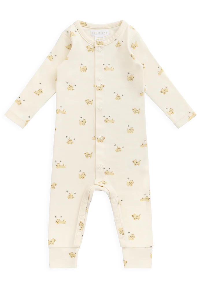 Baby onesie with gold paw print pattern on a white background