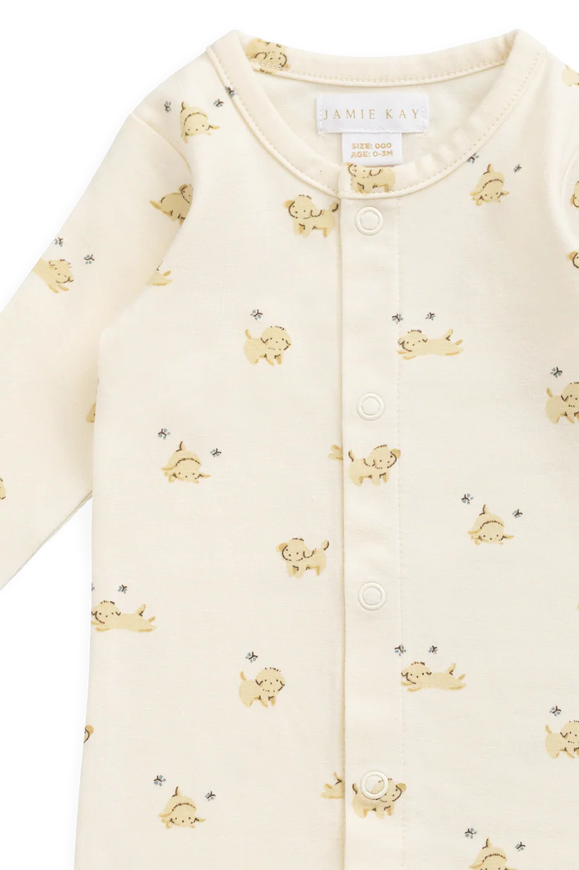 Baby onesie with puppy pattern on a white background