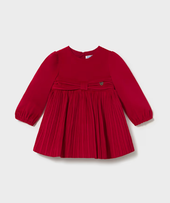 A long-sleeve baby dress in vibrant red, featuring a pleated skirt, a matching pleated waist bow, and a small embroidered rose detail on the chest, displayed against a light gray background.
