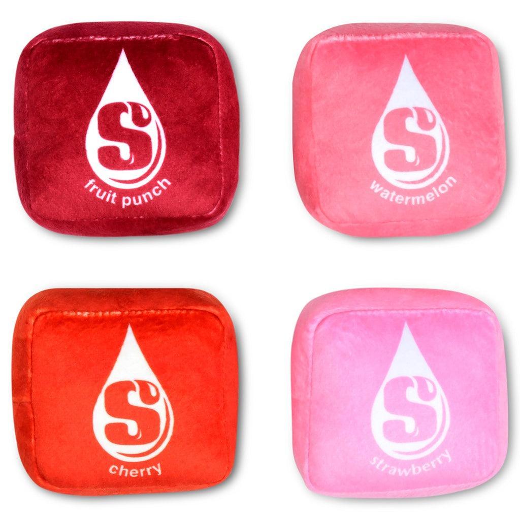 removable starburst candies that are inside the packaging: pink, light pink, dark red and red. 