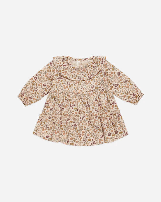 baby girl dress with big ruffle collar and buttons going down the center of the dress. buttons are wooden. floral print has an autumnal feel