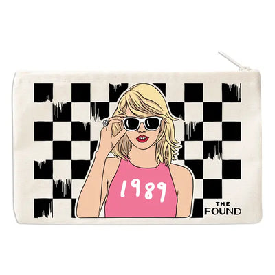 rectangular pouch with Taylor Swift on the front in sunglasses wearing a 1989 tank top 