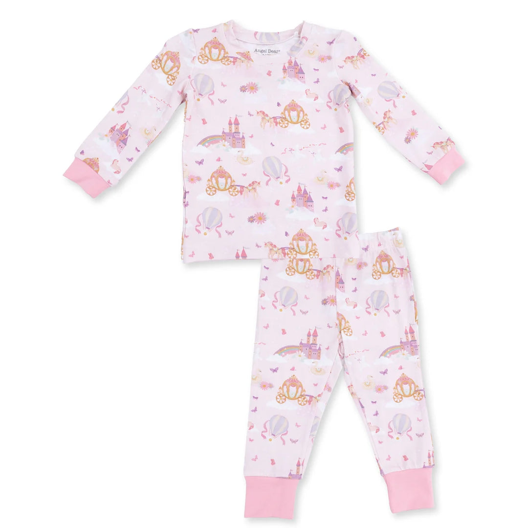 A two-piece children's pajama set by Princess Design, featuring a long-sleeve top and matching pants in light pink with an all-over whimsical print of castles, carriages, and hot air balloons, finished with solid pink cuffs.