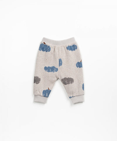 gray melange sweatpants with blue and gray pumpkins all over it. 