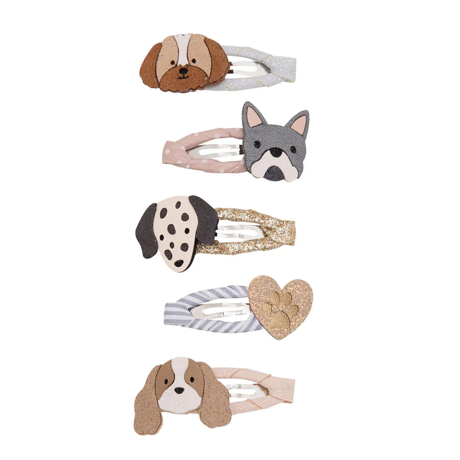 Five dog-themed hair clips arranged vertically on a white background, featuring different dog breeds and textures including brown and white, gray and white, black and white, striped gray and white, and a glittery gold heart.