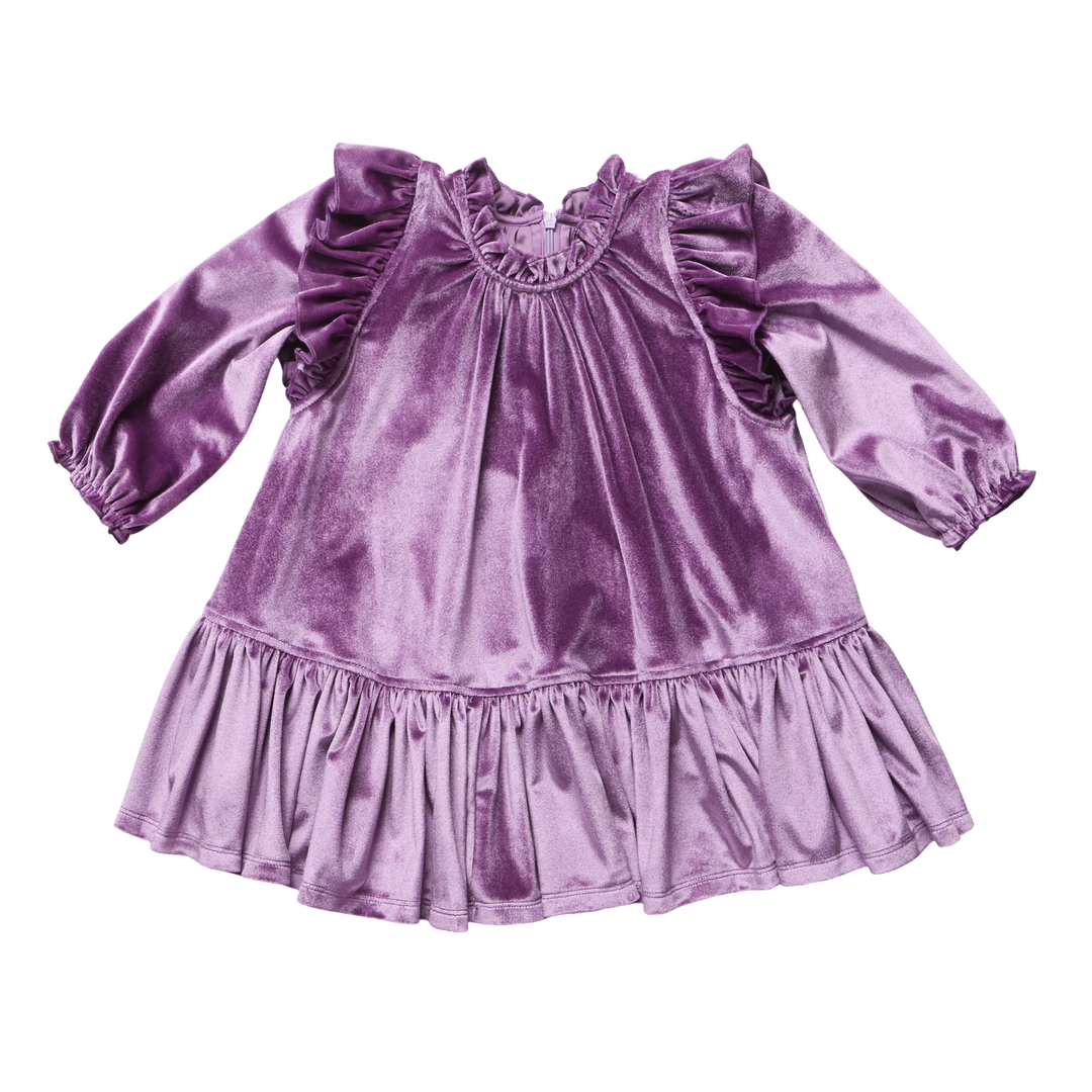 purple velvet dress with ruffle at the shoulder and ruffle at the bottom.