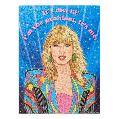 another picture of the puzzle. the picture shows Taylor Swift dressed in a colorful blazer with the saying that reads "its me, hi! I'm the problem it's me. "