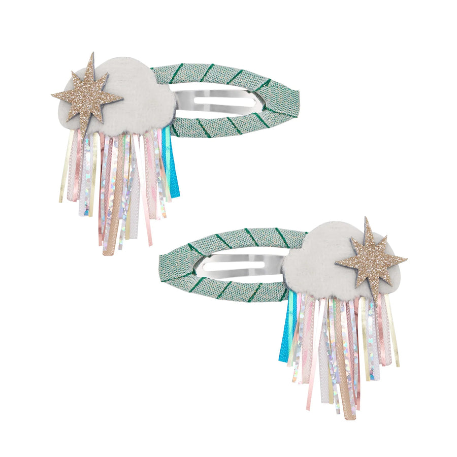 Two decorative hair clips with star and cloud designs on a white background