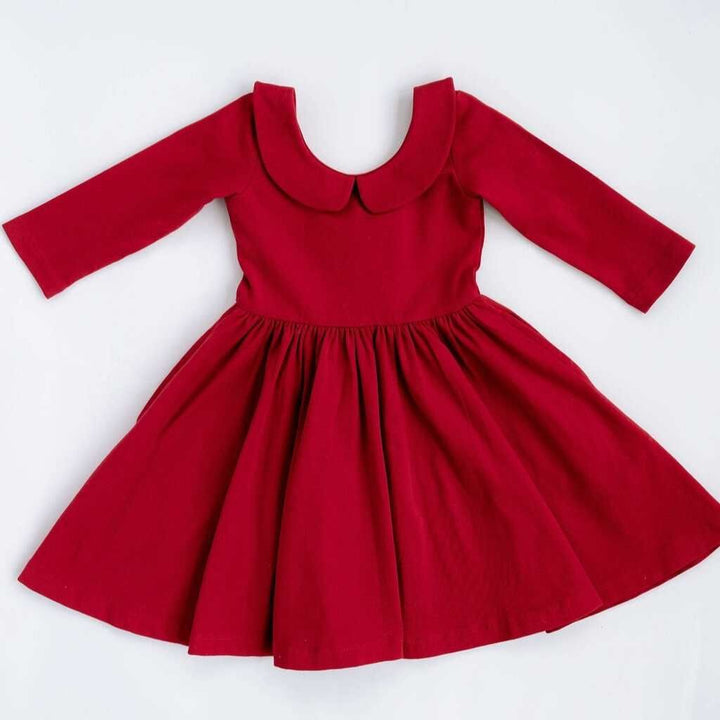 Red dress with a Peter Pan collar on a white background