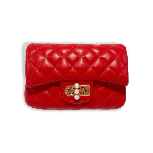 Red quilted handbag with pearl embellishments on a white background