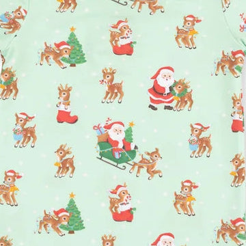 A long-sleeve children's pajama top in light mint green with an all-over Christmas print featuring Santa Claus, reindeer, and Christmas trees. The sleeves and cuffs are solid light green.