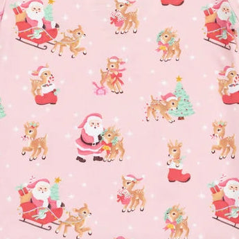 A pink long-sleeve children's pajama top featuring an all-over Christmas print of Santa Claus in sleighs and reindeer, with solid pink ribbed cuffs and collar, shown on a plain white background.