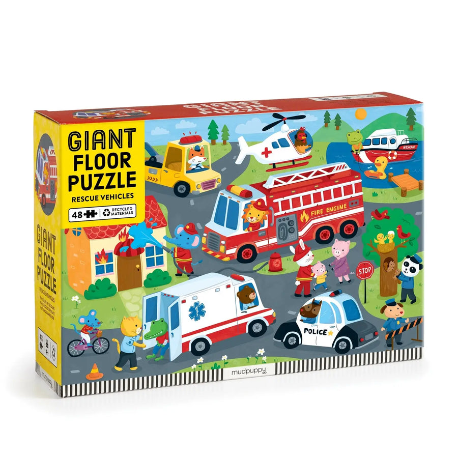 Box of a giant floor puzzle with rescue vehicles on a white background